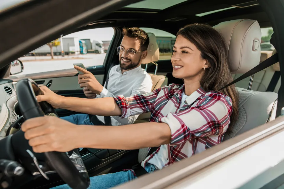 happy-woman-driving-car-driving-979572552