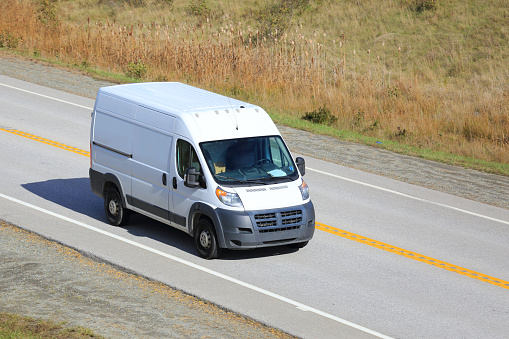 Van being driven on a highway